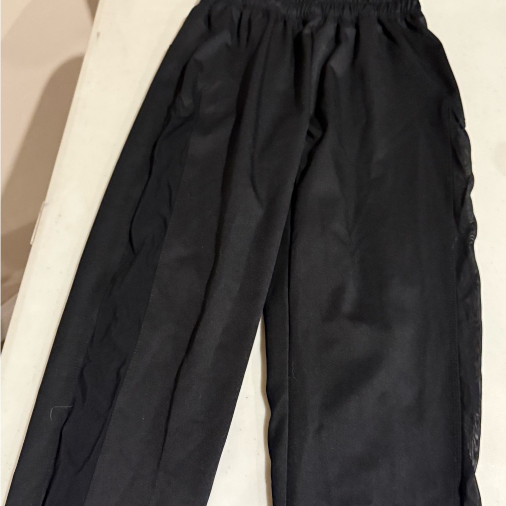 Give dance girls  Black Pants with sheer sides. GUC. YXL